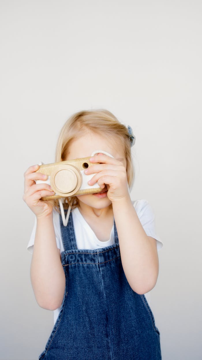 Girl Taking Photo Using a Camera